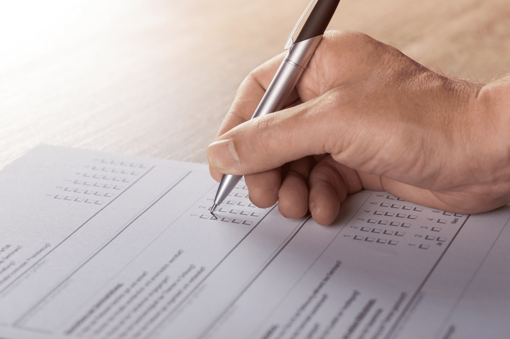 Event attendee filling a debriefing questionnaire