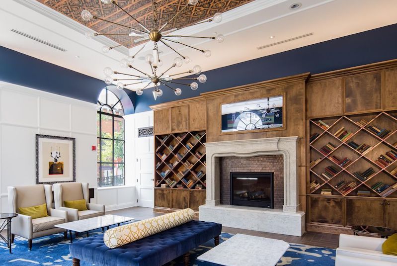 The library at the Hotel Indigo, which features diamond-shaped shelving and a collection of classics.