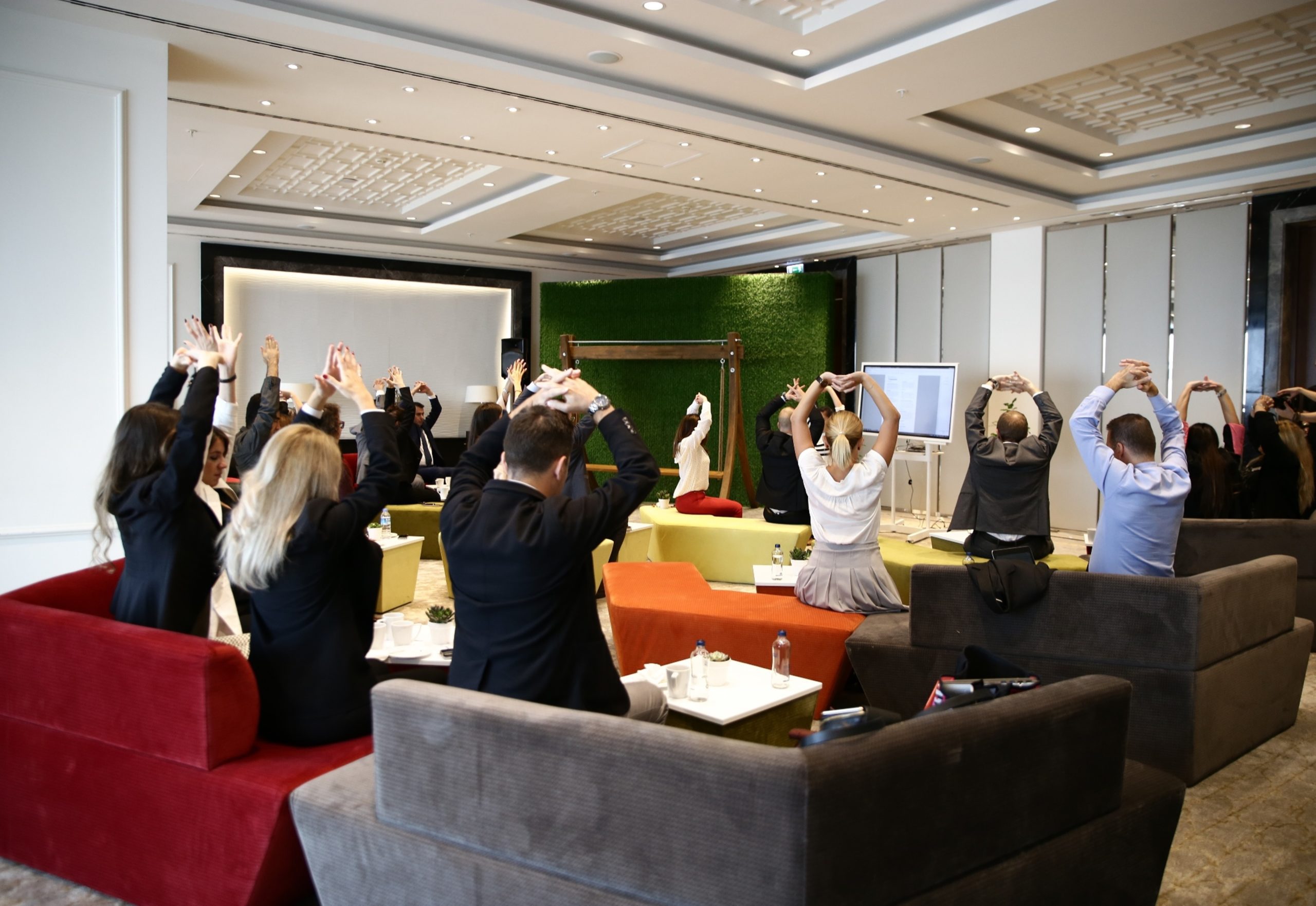 Meeting room participants stretching