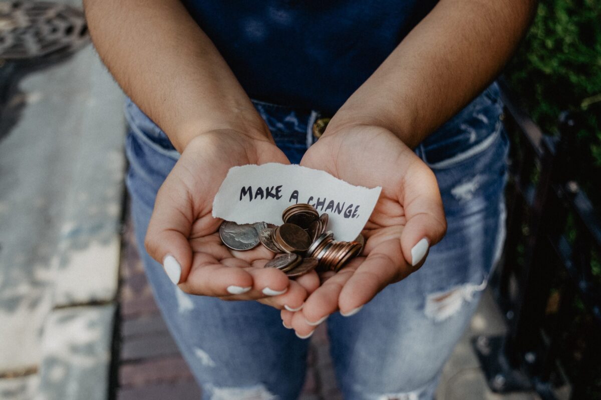 Hands outstretched with change in them as an alternative to boycotts