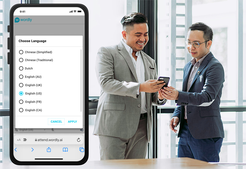 An enlarged phone screen is visible on the left-hand side on the image showing the Wordly drop-down menu of language options (Chinese, Dutch, English, etc.). This screenshot is overlayed above a photo of two men looking at a phone together, with one smiling and seeming to give instructions to the other.