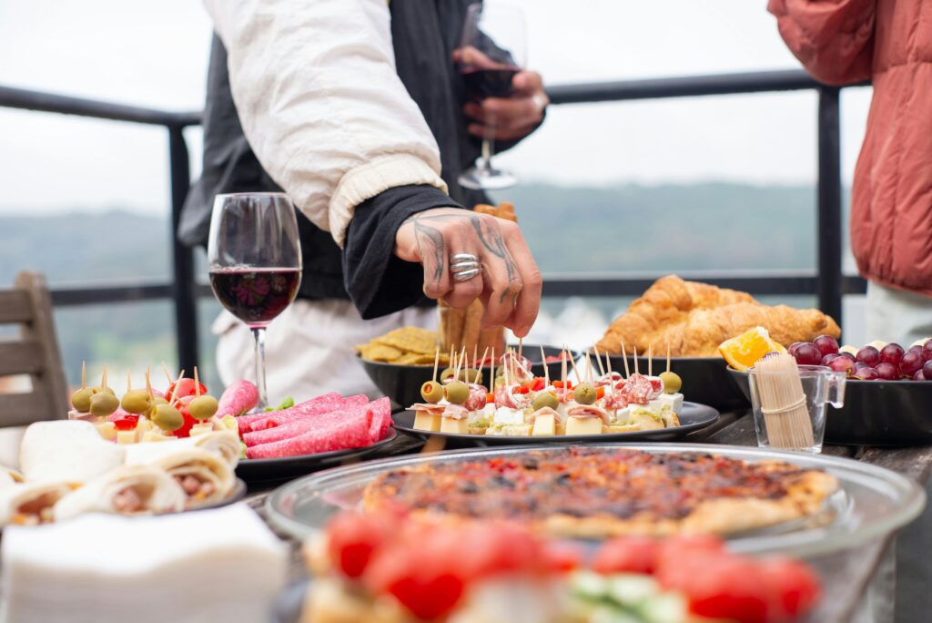 people at an event snack table