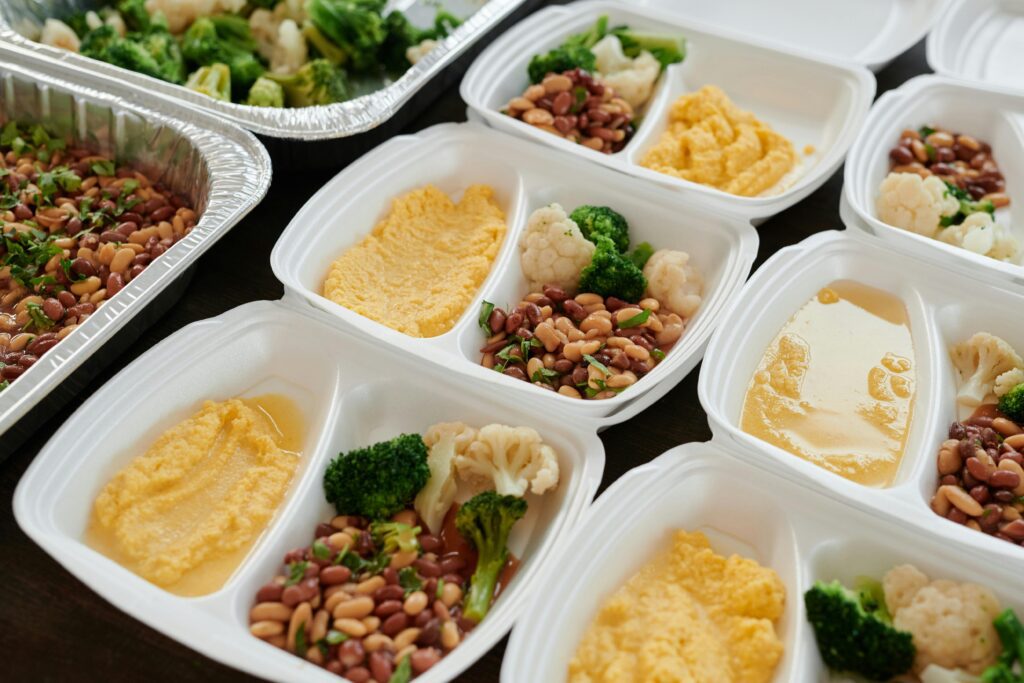 packing unserved food from an event for donation