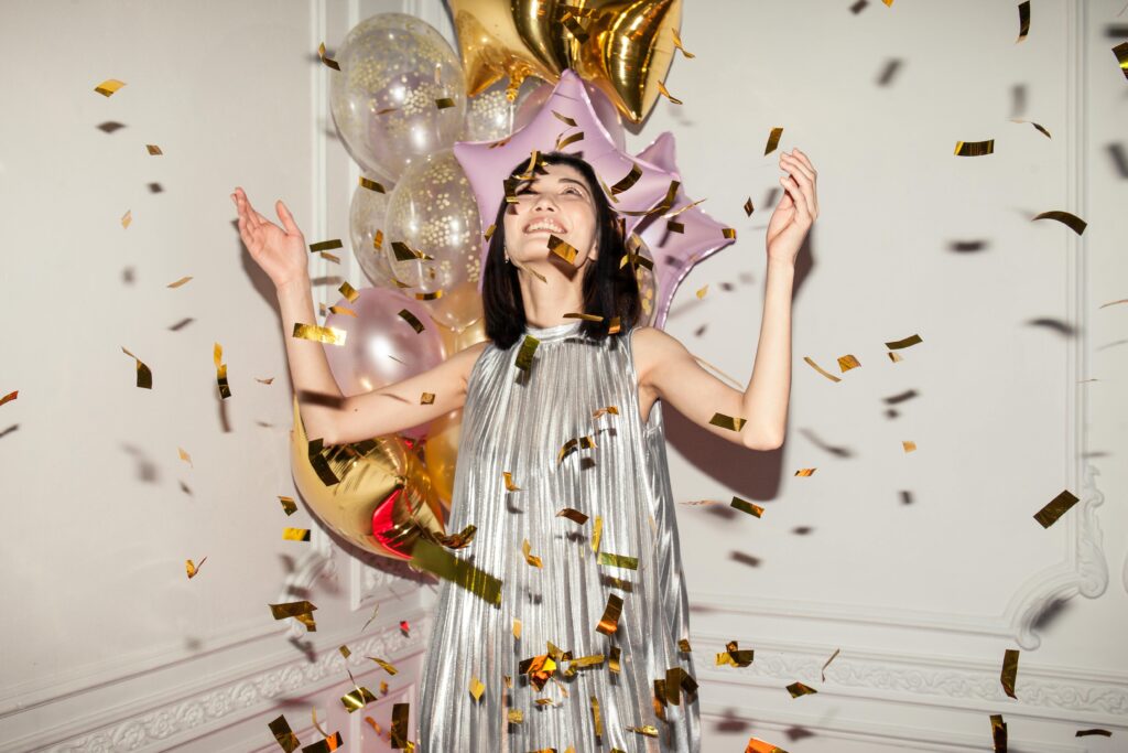 a woman having fun at a party - common event planner cliché of having a glamorous life