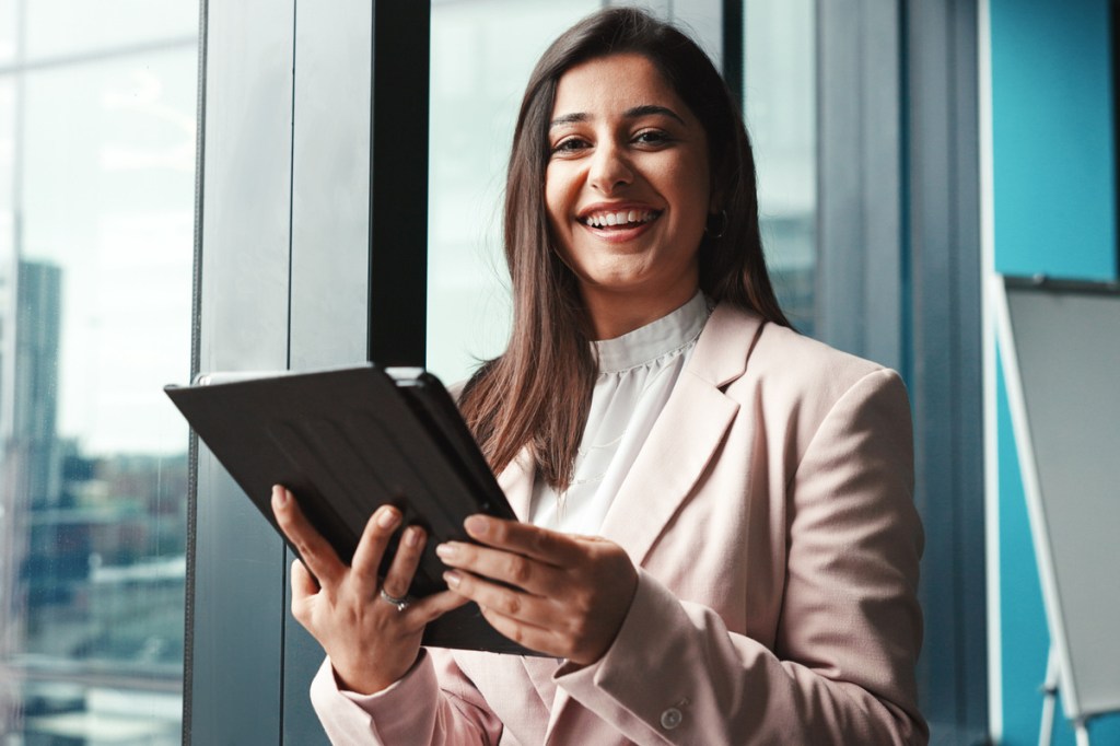 corporate meeting planner with a tablet