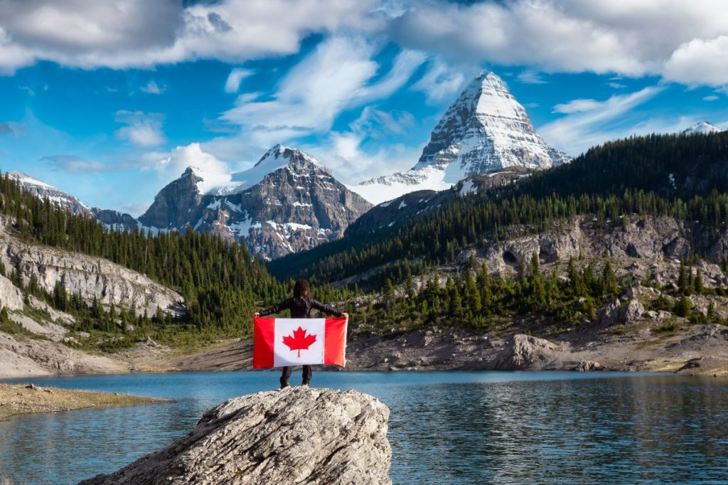 Canadian flag with mountains in backdrop