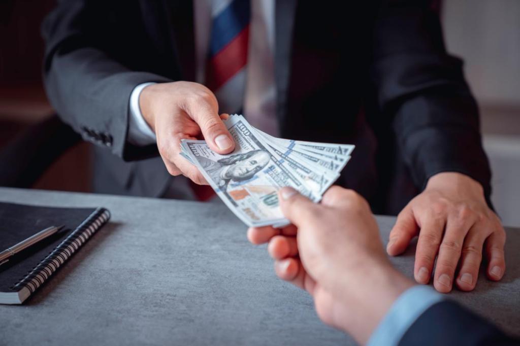 Businesspeople handing cash to each other for a cancellation.