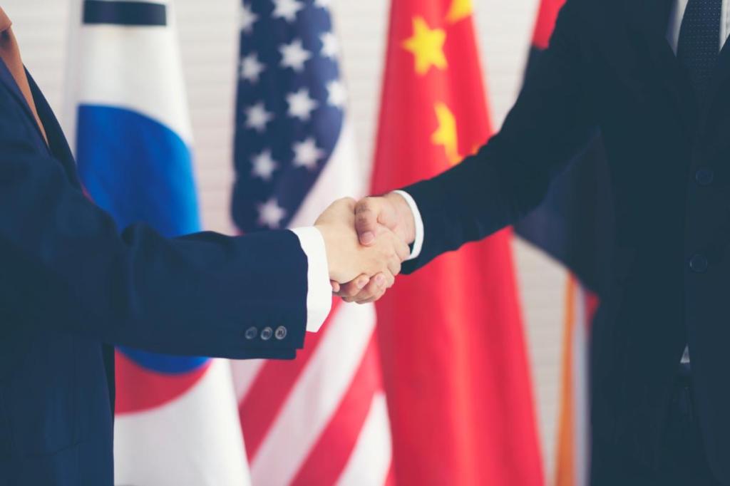 US-China businesspeople shake hands tariffs