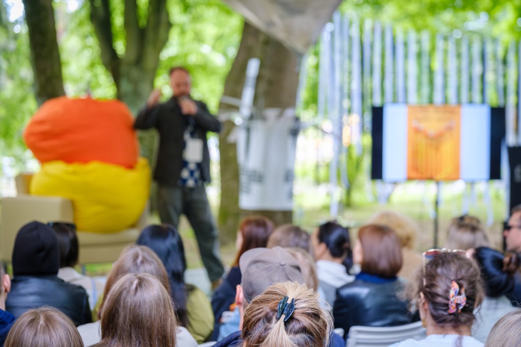 attendees at an outdoor session of a summer event
